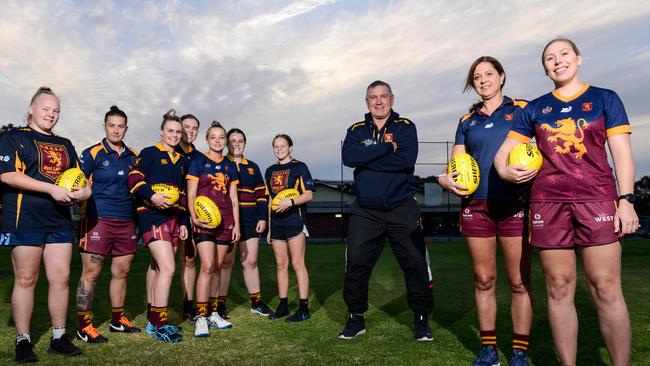 Greg Phillips with SMOSH West Lakes women's division one players ahead of last season. Phillips has stepped aside with Brad Day taking the coaching reins. Picture: Brenton Edwards