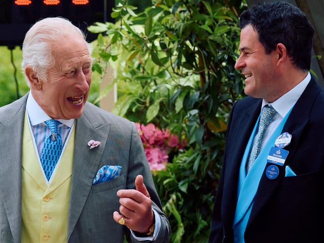 Britain's King Charles III speaks with Henry Dwyer, trainer of Asfoora, the winning horse of the King Charles III Stakes (Group 1), on the first day of the Royal Ascot horse racing meeting, in Ascot, west of London. Picture: AFP