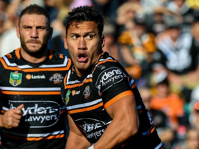 Elijah Taylor of the West Tigers runs with the ball during the Round 16 NRL match between the Wests Tigers and the Gold Coast Titans at Leichhardt Oval in Sydney, Sunday, July 1, 2018. (AAP Image/Brendan Esposito) NO ARCHIVING, EDITORIAL USE ONLY