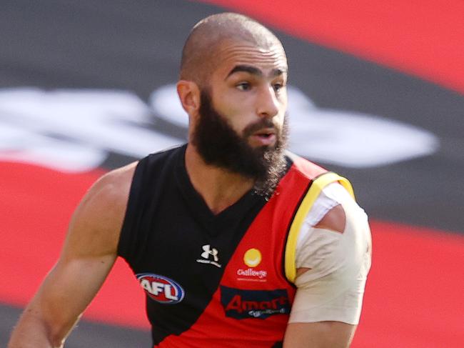 AFL Round 18. 19/09/2020.  Essendon vs Melbourne at Metricon Stadium, Gold Coast.  Adam Saad of the Bombers clears from defence  . Pic: Michael Klein