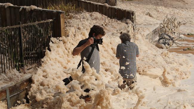 Beachfront houises, between Stuart and Ramsay streest at Collaroy, are being impacted again, but this time by foam created by the massive surf. Picture: John Grainger