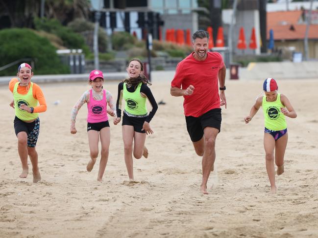 Health of the Nation campaign ambassador Sam Wood runs for health with Port Melbourne Nippers. Picture: David Caird