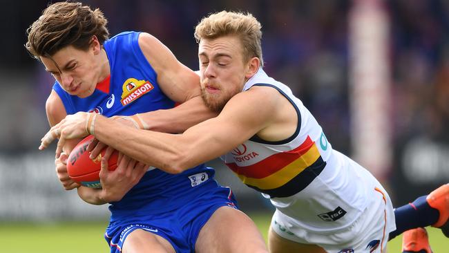 Hugh Greenwood tackles Patrick Lipinski in Adelaide’s loss to the Western Bulldogs in Ballarat on Sunday. Picture: Quinn Rooney (Getty).