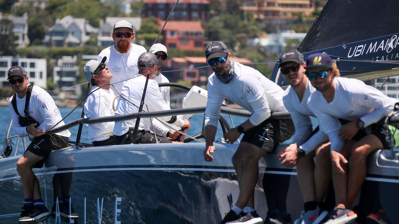 Crew aboard the yacht Alice at the start of the race.