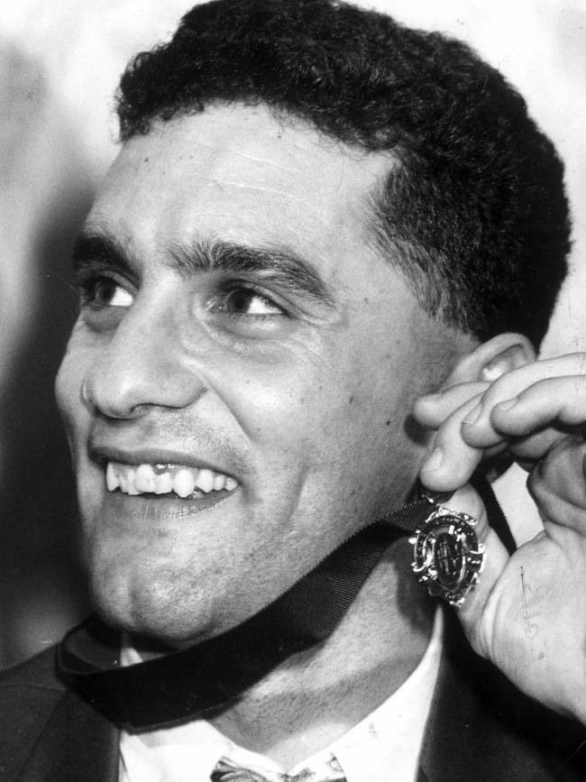 Footscray footballer Tony Liberatore shows off his 1990 Brownlow Medal.