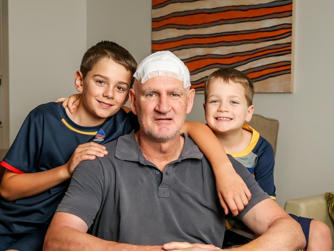 Mark Mickan with his sons, Fletcher, 11, and Spencer, 7, in Melbourne following his Parkinson’s surgery. Picture: Tim Carrafa