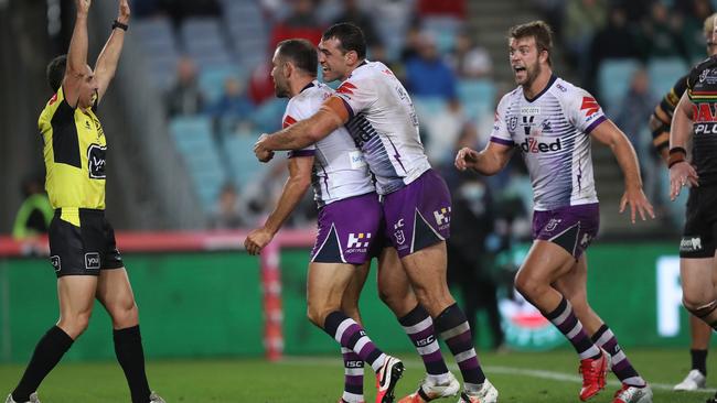 Melbourne's Cameron Smith celebrates after scoring a try Picture: Brett Costello