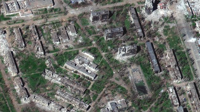 This satellite image by Maxar Technologies shows heavy damage to residential apartment buildings in the Livoberezhnyi District of Mariupol.