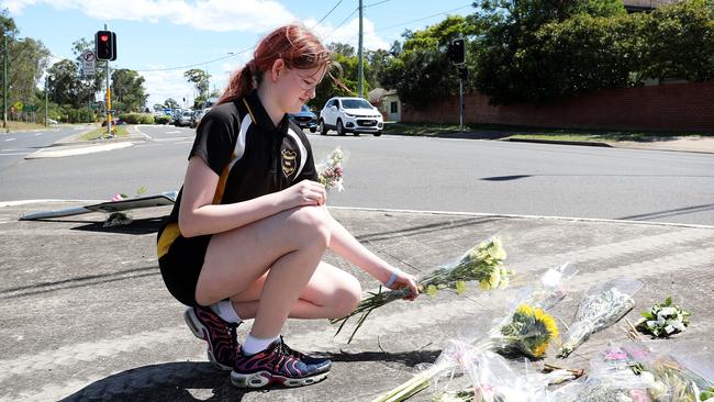 Friend Alyssa Dransfield 12, leaving flowers at the scene. Picture: Tim Hunter.