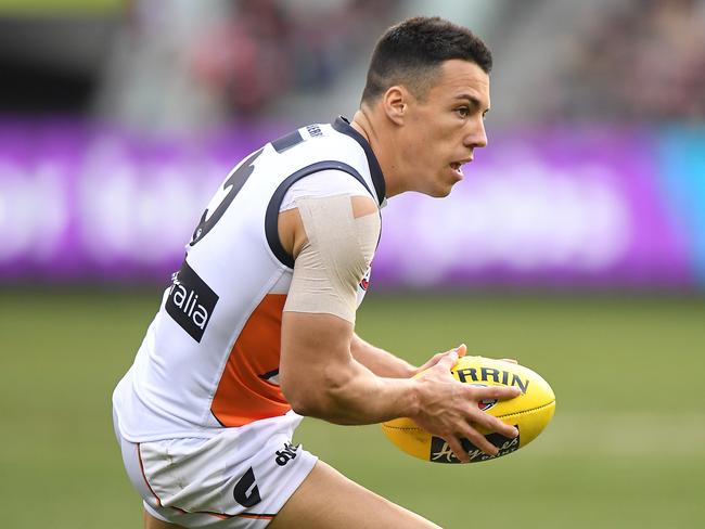 Dylan Shiel of the Giants controls the ball during the Round 23 AFL match between the Melbourne Demons and the Greater Western Sydney (GWS) Giants at the MCG in Melbourne, Sunday, August 26, 2018. (AAP Image/Julian Smith) NO ARCHIVING, EDITORIAL USE ONLY