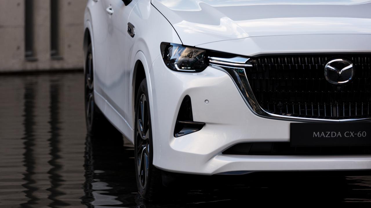 The car has a large, squared-off spin on Mazda’s grille, and smaller headlights than other models.