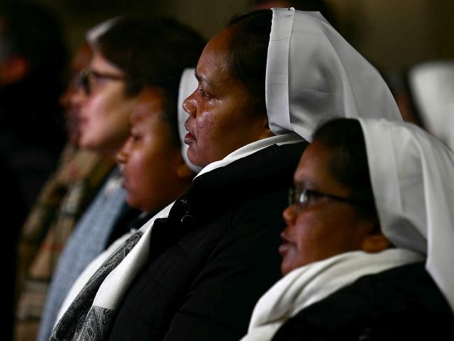 A group of nuns pray during a rosary prayer for the health of Pope Francis in St Peter’s Square at the Vatican City. Picture: AFP