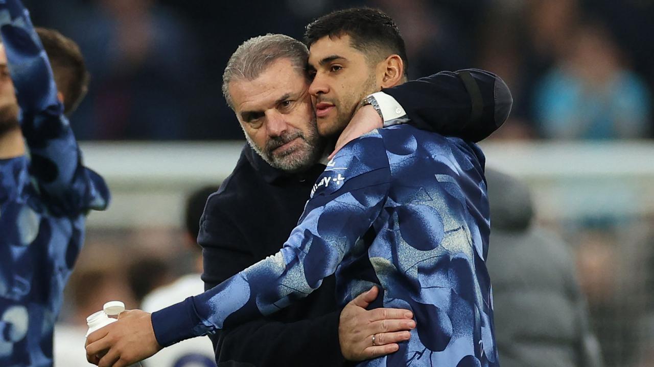 Ange Postecoglou and Cristian Romero. Photo by Adrian Dennis / AFP.