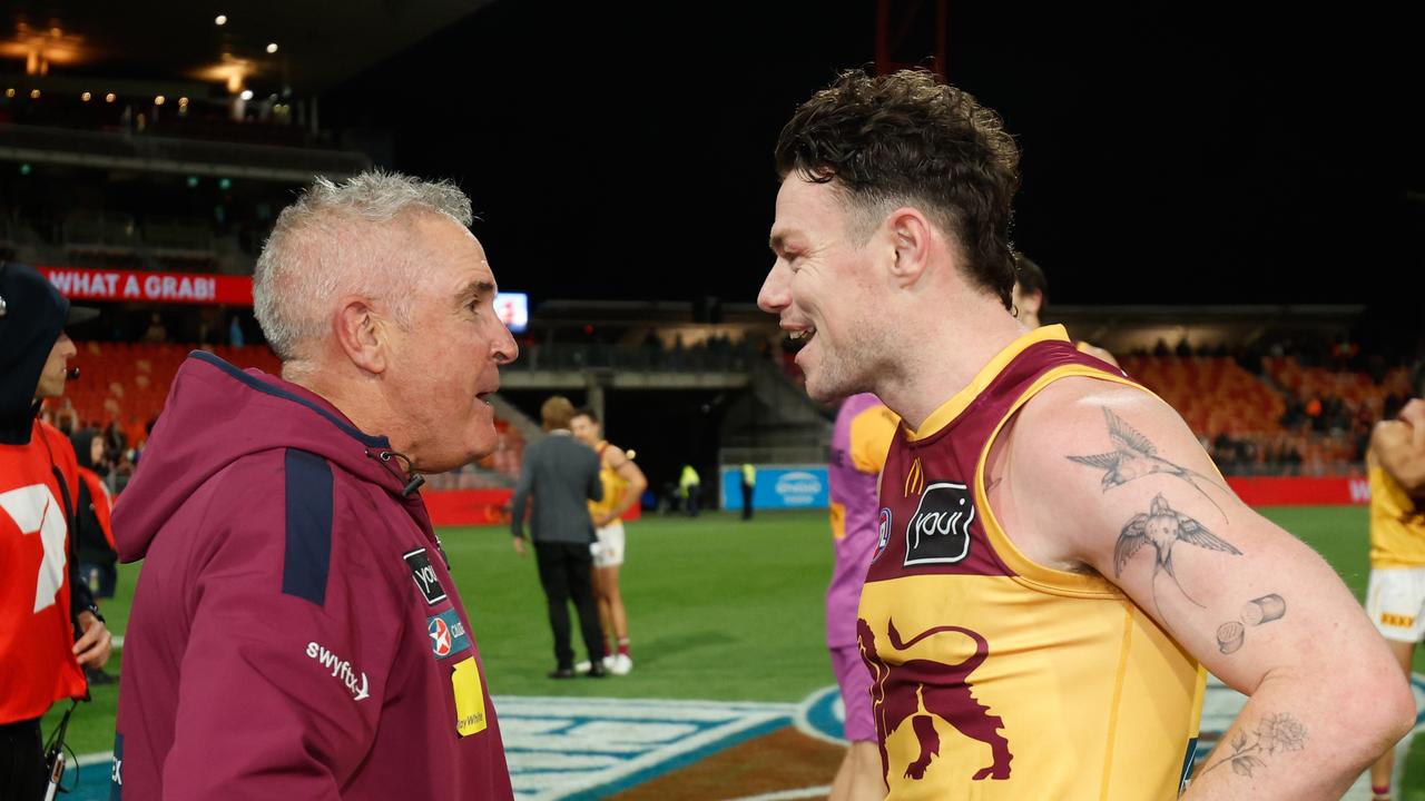 SYDNEY, AUSTRALIA - SEPTEMBER 14: Lachie Neale of the Lions celebrates with Chris Fagan, Senior Coach of the Lions during the 2024 AFL First Semi Final match between the GWS GIANTS and the Brisbane Lions at ENGIE Stadium on September 14, 2024 in Sydney, Australia. (Photo by Dylan Burns/AFL Photos via Getty Images)