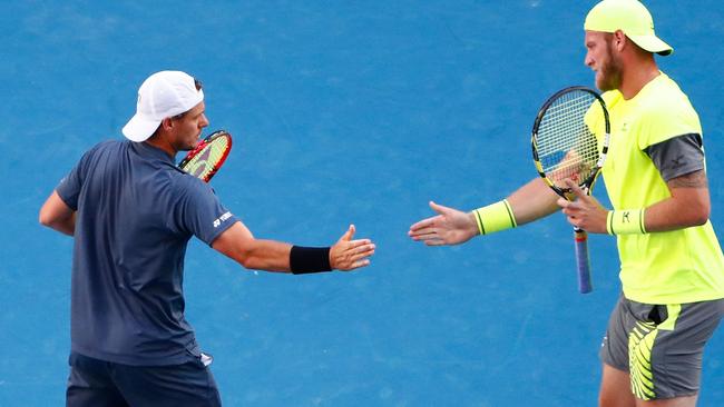 Sam Groth and Lleyton Hewitt are battling to keep their doubles dream alive. Picture: Getty