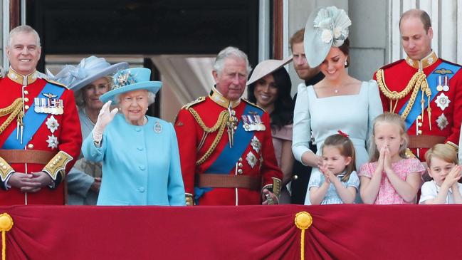 Princes Andrew, Charles, Harry and William in uniform on the balcony of Buckingham Palace in 2018. Picture: AFP.