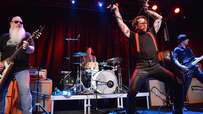Singer of Eagles of Death Metal - Jesse Hughes (C) performs on the stage of the Debaser Medis in Stockholm, on February 13, 2016. / AFP / TT News Agency / Vilhelm Stokstad/TT / Sweden OUT