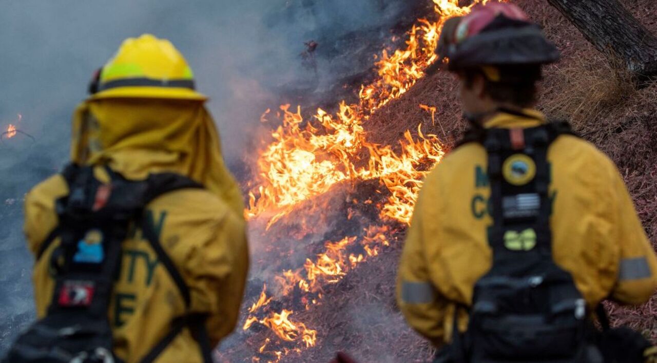 Firefighters race to contain LA wildfires as winds expected to pick up