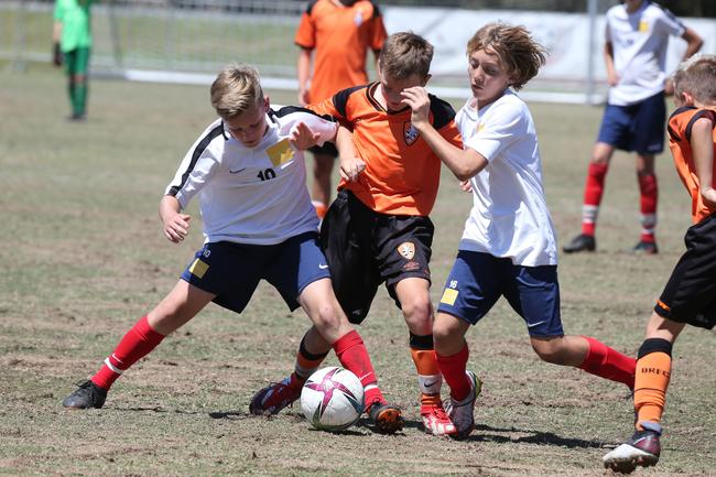 The Premier Invitational football tournament on the Gold Coast. Brisbane Roar Orange v TFC Brisbane White under-13s in action. Picture: Mike Batterham.