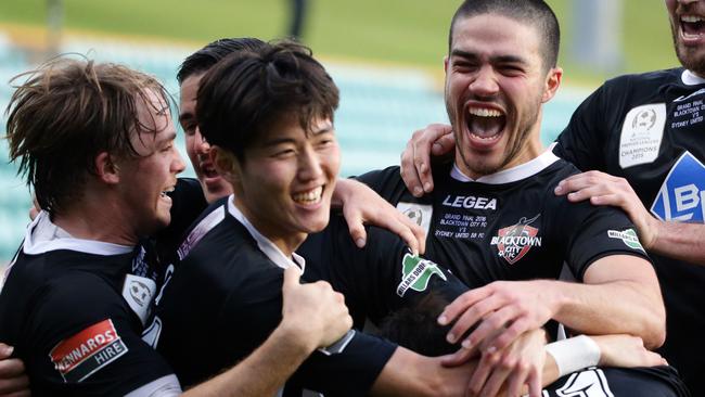 Blacktown FC players celebrate with Danny Choi. Picture: Craig Wilson