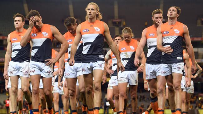 Giants players leave the field after their Round 8 loss to Hawthorn. Picture: AAP Images