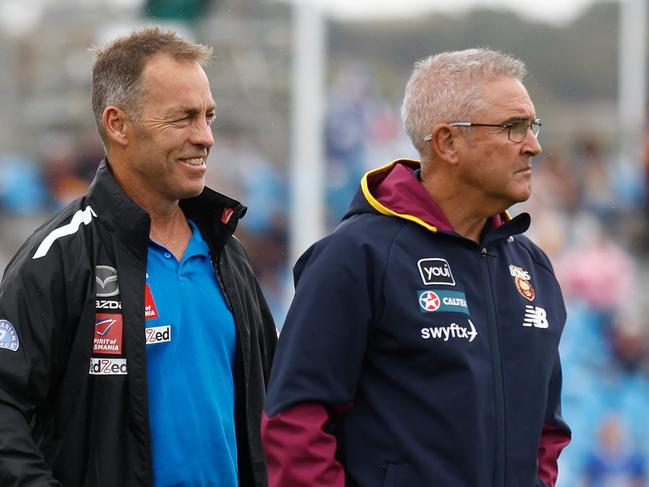 ADELAIDE, AUSTRALIA - APRIL 15: Chris Fagan, Senior Coach of the Lions and Alastair Clarkson, Senior Coach of the Kangaroos embrace before the 2023 AFL Round 05 match between the Brisbane Lions and the North Melbourne Kangaroos at Adelaide Hills on April 15, 2023 in Adelaide, Australia. (Photo by Michael Willson/AFL Photos via Getty Images)