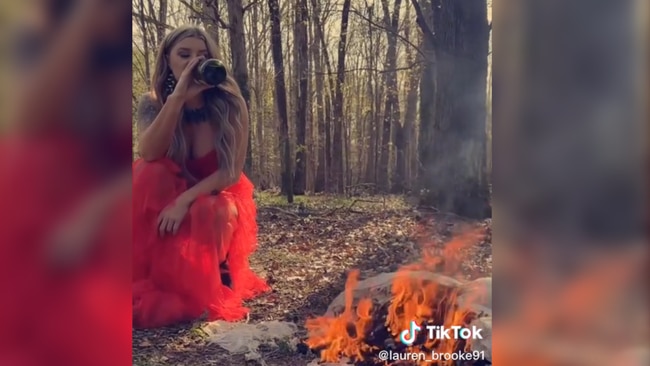 Lauren has gone viral for burning her wedding dress in a divorce photo shoot. Source: TikTok