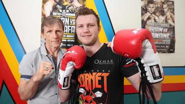 Trainer Glenn Rushton and Jeff Horn with the Zerafa gloves. Photo: Annette Dew