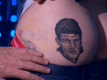 Sam Newman's face was tattooed onto Dane Swan's backside in 2014. Picture: Supplied/screengrab