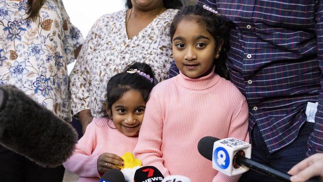 Tharnicaa and Kopika Murugappan speak to the media outside of Perth Airport. (Photo by Matt Jelonek/Getty Images)