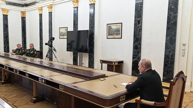 Vladimir Putin meets with Russia's Defence Minister Sergei Shoigu and Valery Gerasimov (R-L), Chief of the General Staff of the Russian Armed Forces. Picture: TASS via Getty Images.