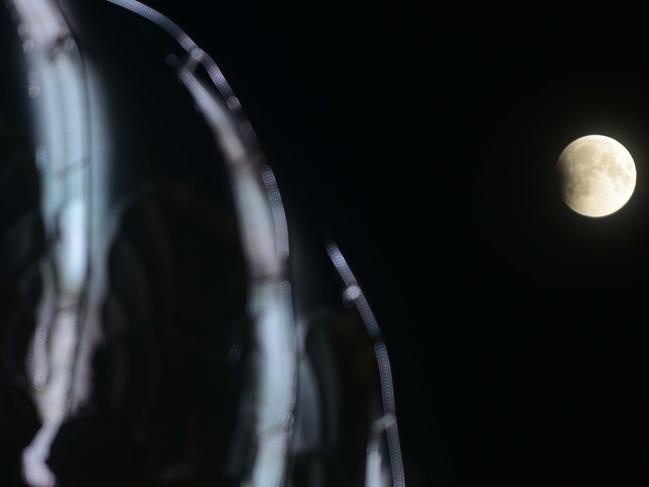 This picture shows the full moon during a 'blood moon' eclipse beside the Golden temple in Amritsar. Picture: AFP