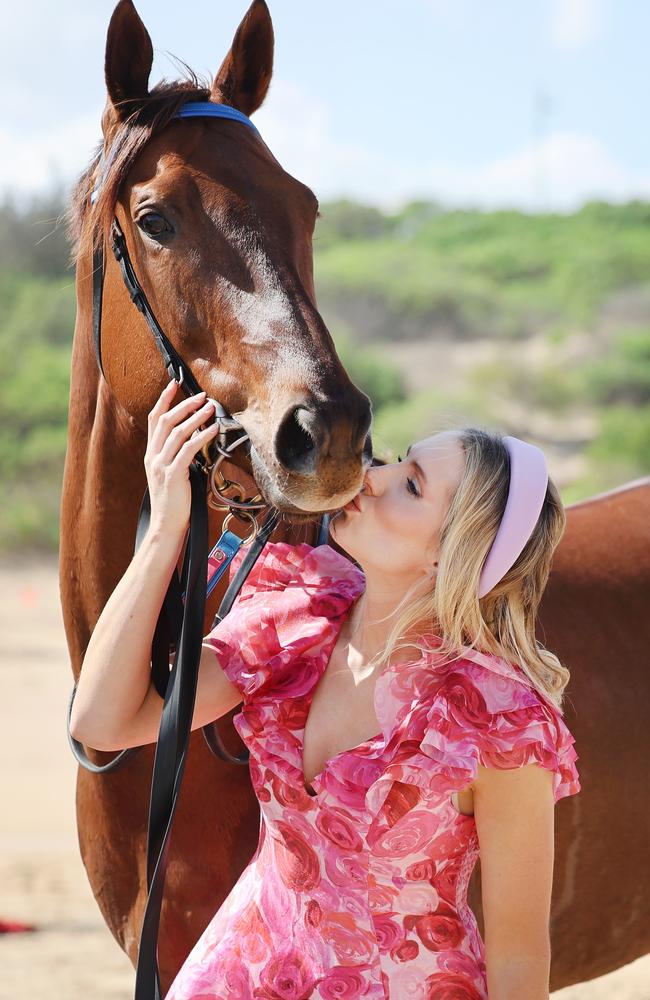 Bella Nipotina accepts a kiss from Sky Racing analyst Ally Mosley. Picture: Rohan Kelly