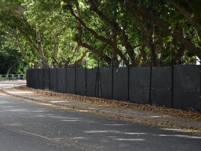 Darwin Council has put up black plastic wrap on Gardens Oval fence after multiple incidents of abuse, mostly racial, being hurled at players. Picture: RAPHAELLA SAROUKOS