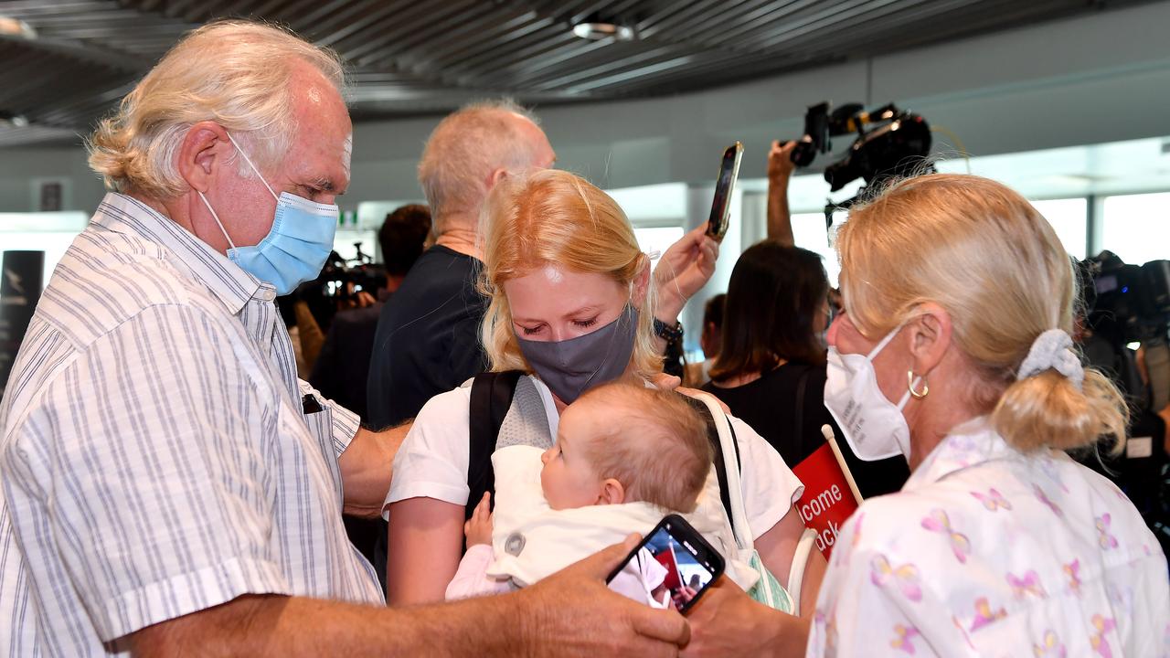 Rob and Maja Fyfe greet their daughter Alexandra Harg and granddaughter Hazel. Picture: John Gass