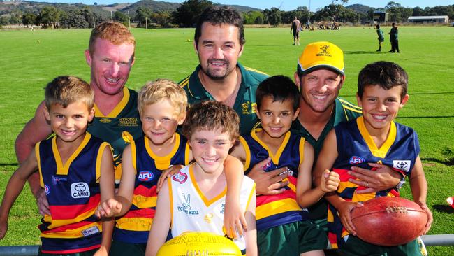 Clay Sampson (second from right) with son Hayden when he started playing his junior football at Myponga-Sellicks.