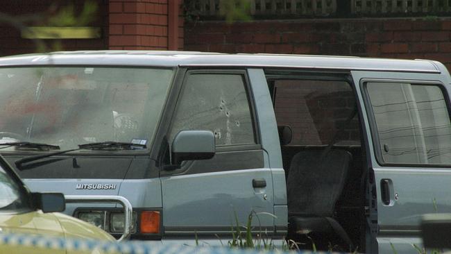 Bullet holes and blood mark the van in which Jason Moran was gunned down.