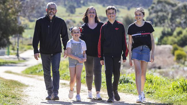 Glen and Carli Springate with their children Wilson and Madeline, both 12, and Lois, 7, near their home in Castlemaine in regional Victoria. Picture: Aaron Francis