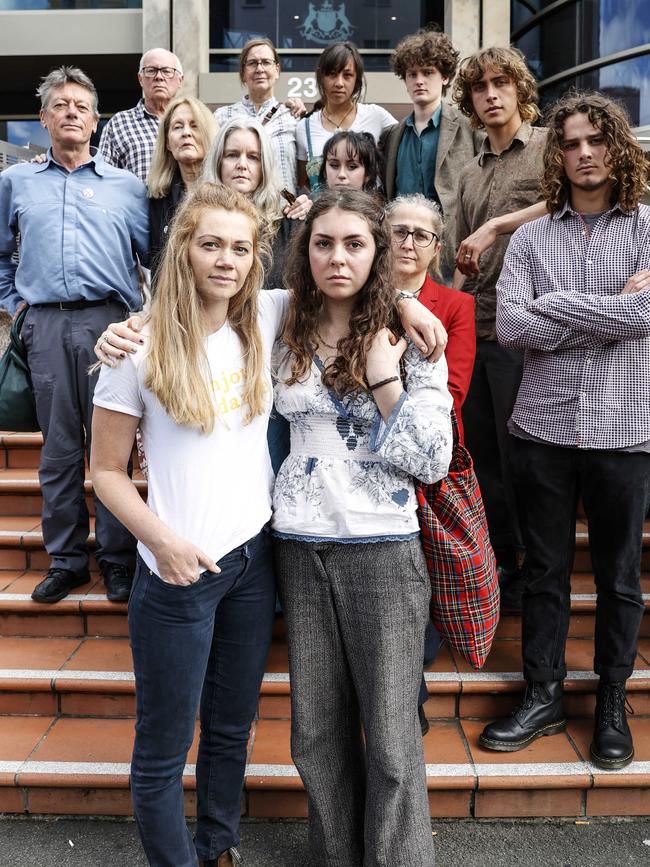 Extinction Rebellion activists (front) Claire Burgess and Stella McGill alongside fellow activists who attended Hobart Magistrates Court today after being charged for last year's protest in the CBD. Picture: Zak Simmonds