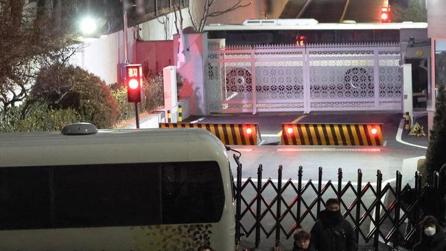 Police and anti-corruption investigators arrive at the presidential residence in Seoul. Picture: AFP.