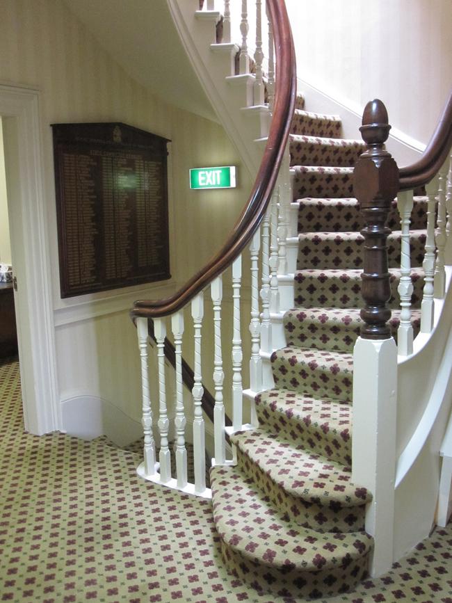 <b>BEFORE: </b>The original carpeted staircase.