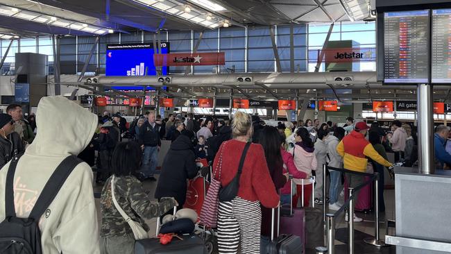 Travellers have been warned to expect further delays as strong winds cause chaos at Sydney Airport. There were multiple delayed and some cancelled domestic flights departing Sydney Airport on Saturday afternoon due to the weather. Picture: NewsWire