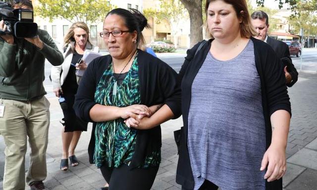 At the Supreme Court, Jennifer Kennison, (R) leaves court after submissions into manslaughter charges. She is charged with shaking her baby to death. 26 March 2018. (AAP Image/Dean Martin)