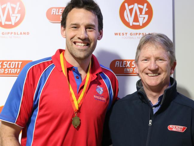 Cameron Pedersen with his league medal and Paul Dunlop of West Gippsland sponsor Alex Scott.