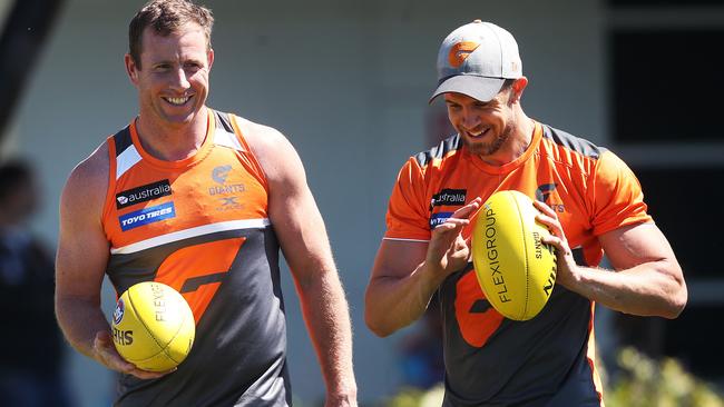 Steve Johnson and Brett Deledio walk laps during GWS Giants training. Picture: Phil Hillyard