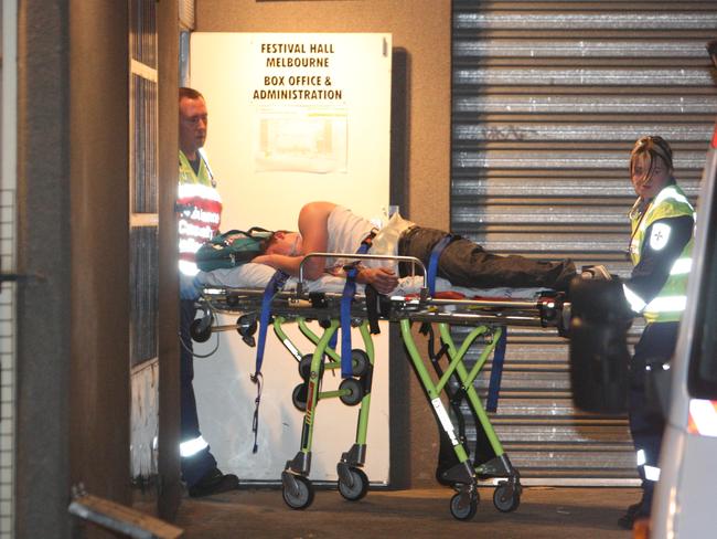 A reveller is stretchered away from a dance party held at Melbourne’s Festival Hall. Despite the well-known risks, plenty of people continue to take a risk with illegal drugs.