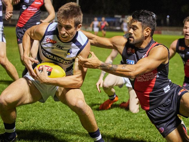 South's Bradley Crabb gets tackled by West's Zachary Bates at Richmond Oval in Richmond, in the match between West Adelaide and South Adelaide, Tuesday, April 24, 2018. (AAP Image/MATT LOXTON)