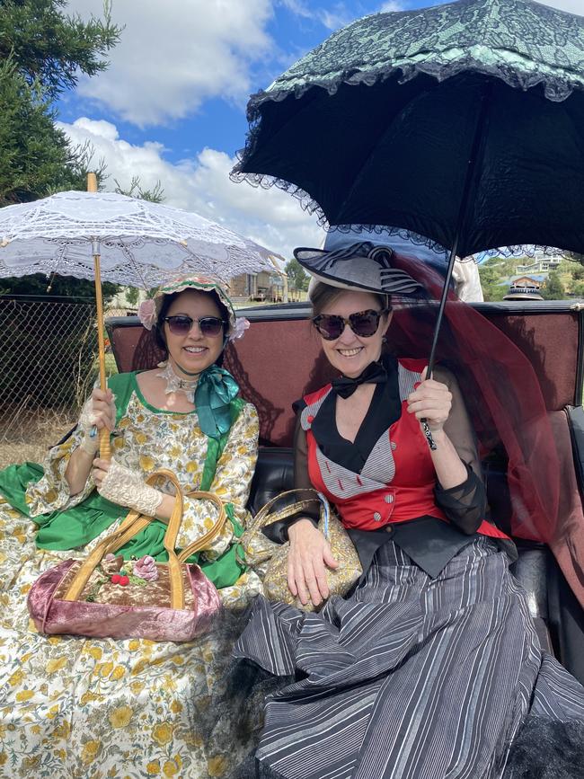 Nicole and Rebecca looking fabulous and sun safe in their outfits, riding into the fair on a horse carriage. Picture: Niki Iliagoueva