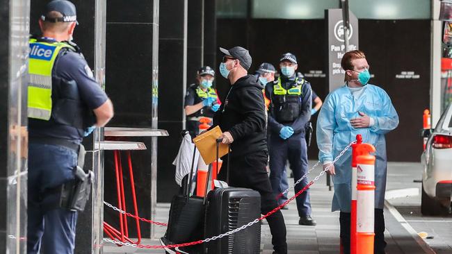 Returned travellers arrive at their quarantine accommodation. Picture: Getty