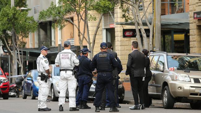 Police on the scene of the stabbing on Bunn St where a crime scene has been established. Picture: Richard Dobson